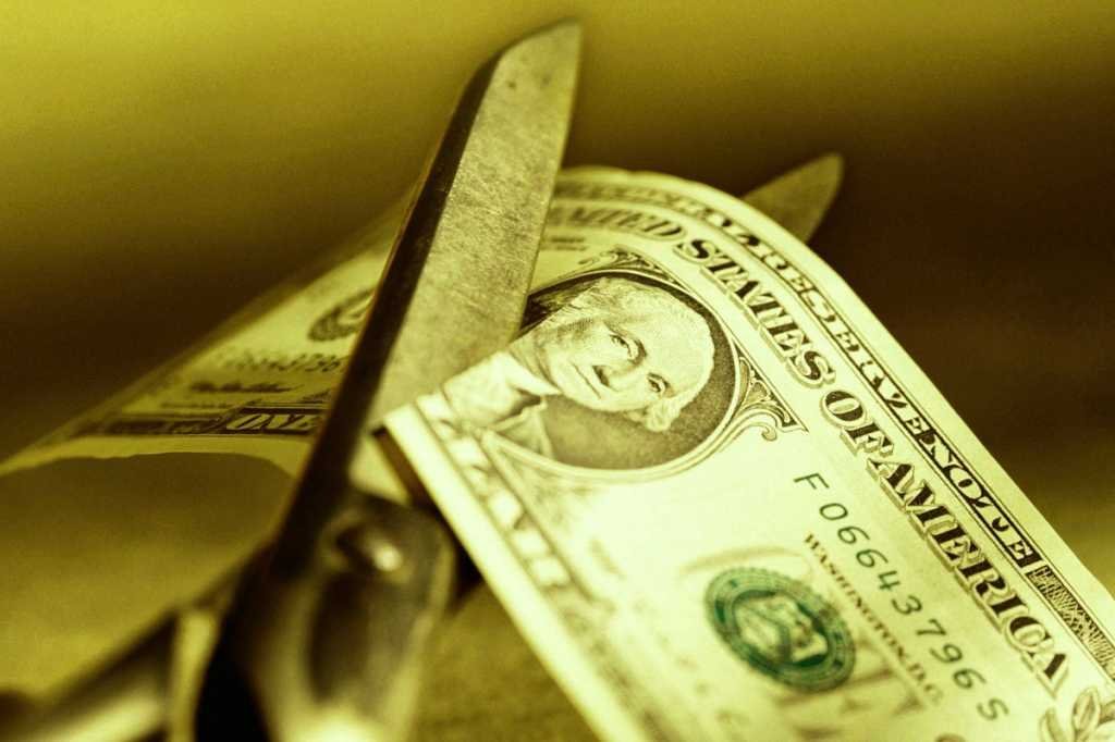 cutting cost scissors money george washington dollar bill savings