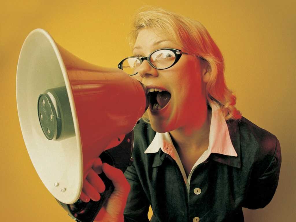 woman shouting into bullhorn